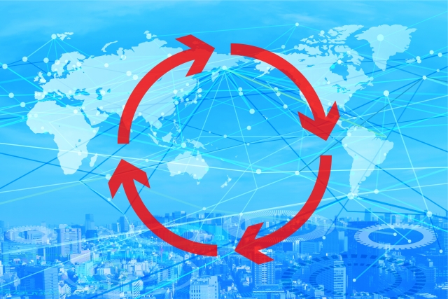 青い背景の上空から見た街とサイクルを表す円を描いた矢印